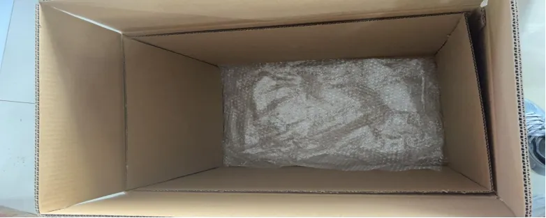 Top-down view of open carton showing inner layers and dividers.